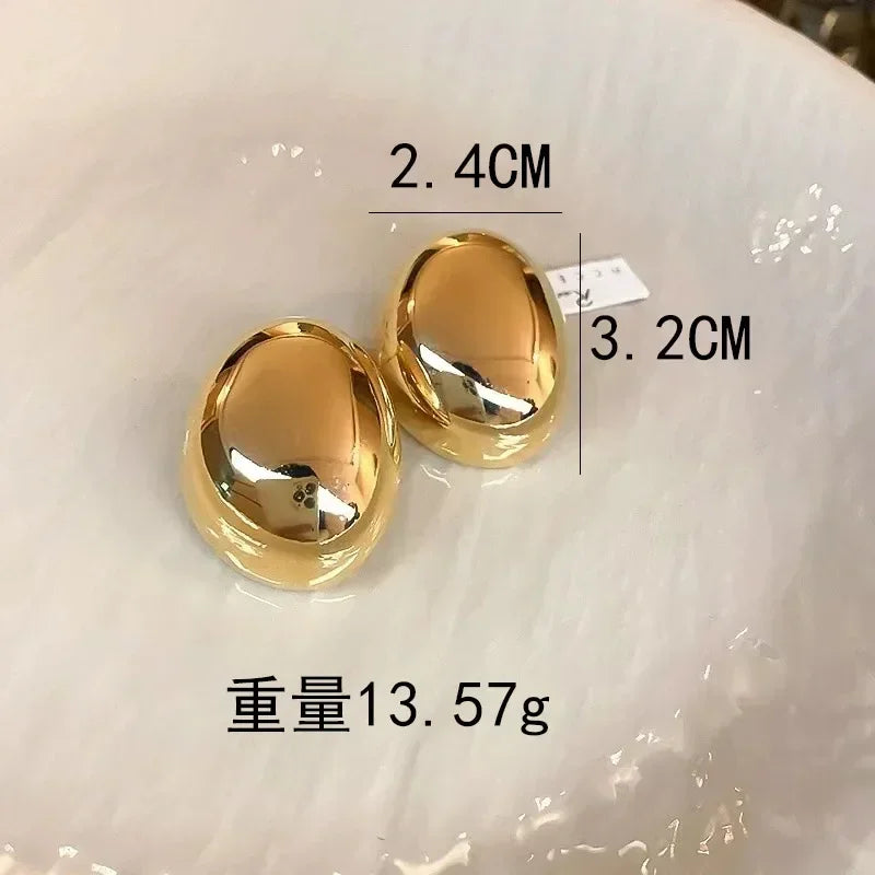 Exaggerated Water Drop Oval Glossy Metal Earrings – Gold/Silver, Trendy Studs for Women & Girls.